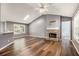 Open floor plan in living room with hardwood floors and a stone fireplace at 6797 Braswell Mountain Rd, Rockmart, GA 30153