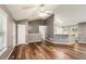 Living room showing hardwood floors, with view to the kitchen and entry at 6797 Braswell Mountain Rd, Rockmart, GA 30153