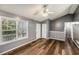 Neutral living room with hardwood floors, abundant natural light, and high ceilings at 6797 Braswell Mountain Rd, Rockmart, GA 30153