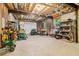 Spacious basement featuring exposed beams, storage shelving, and a variety of tools at 169 Robson Trl, Mcdonough, GA 30252
