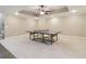 Spacious finished basement featuring neutral carpeting and a sleek ping pong table at 169 Robson Trl, Mcdonough, GA 30252