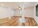Partially finished basement featuring laminate flooring, white support columns, and window at 169 Robson Trl, Mcdonough, GA 30252