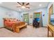 Bedroom with wood floors, work station, and comfortable seating at 169 Robson Trl, Mcdonough, GA 30252