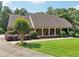 Charming brick home featuring a welcoming front porch and well-manicured lawn at 169 Robson Trl, Mcdonough, GA 30252