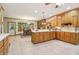 Spacious kitchen with wooden cabinets, tile floors, and a breakfast nook at 169 Robson Trl, Mcdonough, GA 30252