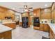 Well-equipped kitchen featuring oak cabinets, stainless steel appliances, and ample counter space at 169 Robson Trl, Mcdonough, GA 30252