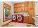 Laundry room includes front loading washer and dryer with built in cabinets at 169 Robson Trl, Mcdonough, GA 30252