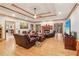 Spacious living room boasts hardwood floors, coffered ceilings, and a cozy fireplace at 169 Robson Trl, Mcdonough, GA 30252