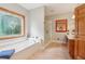 Main bathroom with soaking tub, a large stained glass window, and a walk in shower at 169 Robson Trl, Mcdonough, GA 30252