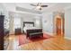 Main bedroom features tray ceiling, hardwood floors, and a seating bench at 169 Robson Trl, Mcdonough, GA 30252