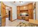 Office features built-in cabinetry and desk, with a view into the kitchen at 169 Robson Trl, Mcdonough, GA 30252