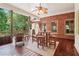 Covered patio with brick wall, ceiling fan, and outdoor furniture set at 169 Robson Trl, Mcdonough, GA 30252