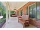 Inviting front porch with a wooden bench and swing, ideal for enjoying the outdoors at 169 Robson Trl, Mcdonough, GA 30252