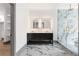 A luxurious bathroom features double sinks, marble floors, and a glass enclosed shower with gold hardware at 2369 Mcafee Rd, Decatur, GA 30032