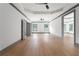 The bedroom features a tray ceiling, a modern fan, hardwood floors, and bright windows at 2369 Mcafee Rd, Decatur, GA 30032