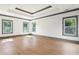 A spacious bedroom features bright windows, hardwood floors, and gray trim throughout the room at 2369 Mcafee Rd, Decatur, GA 30032