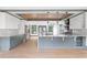 Gourmet kitchen with gray and white cabinetry, stainless steel appliances, and a large island at 2369 Mcafee Rd, Decatur, GA 30032