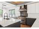 Gourmet kitchen with white marble countertops, stainless steel appliances, and gray cabinets at 2369 Mcafee Rd, Decatur, GA 30032
