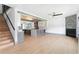 View of the living room, kitchen and stairwell. Beautiful open concept with great flow at 2369 Mcafee Rd, Decatur, GA 30032