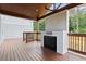 This patio features a stained deck, a fireplace, and an outdoor living space at 2369 Mcafee Rd, Decatur, GA 30032