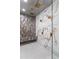 A modern shower features marble walls, gold fixtures, dual shower heads and rain shower head at 2369 Mcafee Rd, Decatur, GA 30032