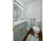 Functional bathroom featuring vanity, toilet, and convenient in-unit washer at 2805 Ne Expressway Ne # B 16, Atlanta, GA 30345