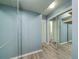 Hallway with hardwood floors, mirrored closet doors, and neutral wall color providing ample storage at 2805 Ne Expressway Ne # B 16, Atlanta, GA 30345