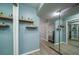 Charming hallway features modern shelves, mirrored closets, and soothing blue walls at 2805 Ne Expressway Ne # B 16, Atlanta, GA 30345