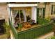 Relaxing patio with wood flooring, seating, and privacy greenery at 2805 Ne Expressway Ne # B 16, Atlanta, GA 30345