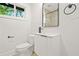 Stylish bathroom featuring sleek vanity, modern faucet, and updated fixtures at 2813 Hillside Rd, Smyrna, GA 30080