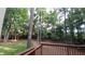 View from deck overlooking a tranquil, wooded backyard at 5190 Southlake Dr, Alpharetta, GA 30005