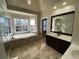 This spacious bathroom features a soaking tub, tiled floors, and double sinks at 5190 Southlake Dr, Alpharetta, GA 30005