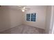 This bedroom offers a ceiling fan and natural light from a window at 5190 Southlake Dr, Alpharetta, GA 30005