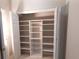 Walk-in closet with custom shelving and wire baskets for organized storage at 5190 Southlake Dr, Alpharetta, GA 30005