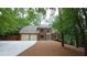Charming two-story brick home featuring a two-car garage and a well-manicured front yard at 5190 Southlake Dr, Alpharetta, GA 30005