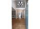 Inviting foyer with gleaming hardwood floors and a view of the upper-level balcony at 5190 Southlake Dr, Alpharetta, GA 30005