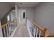 Upstairs hallway with carpet and white railings at 5190 Southlake Dr, Alpharetta, GA 30005