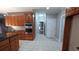 Spacious kitchen displaying stainless steel double oven, granite countertops, and white tile floors at 5190 Southlake Dr, Alpharetta, GA 30005