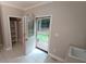 Laundry room with storage shelves, a sink, and access to the back deck and yard at 5190 Southlake Dr, Alpharetta, GA 30005