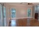 Bright living room featuring hardwood floors, neutral walls, and natural light from the window at 5190 Southlake Dr, Alpharetta, GA 30005