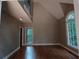 Spacious living room with vaulted ceilings, large windows, and natural light at 5190 Southlake Dr, Alpharetta, GA 30005
