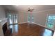 Bright living room boasting a fireplace, hardwood floors, and French doors to the deck at 5190 Southlake Dr, Alpharetta, GA 30005