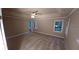 Spacious main bedroom featuring neutral walls, plush carpet, and a ceiling fan at 5190 Southlake Dr, Alpharetta, GA 30005