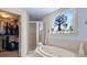 Bright bathroom featuring soaking tub, glass shower, and a walk-in closet at 1376 Parkview Ne Ln, Atlanta, GA 30324