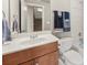 Bathroom featuring a vanity, toilet, shower/tub combination, and a large mirror at 1376 Parkview Ne Ln, Atlanta, GA 30324