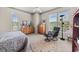 Comfortable bedroom featuring carpet, windows, ceiling fan, and wooden dressers at 1376 Parkview Ne Ln, Atlanta, GA 30324