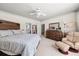 Comfortable bedroom features a ceiling fan, wooden furniture, and an inviting sitting area at 1376 Parkview Ne Ln, Atlanta, GA 30324