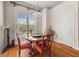 Charming dining area with a round table, elegant chairs, and natural light from the large window at 1376 Parkview Ne Ln, Atlanta, GA 30324