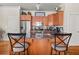 Modern kitchen with stainless steel appliances, granite countertops, and a breakfast bar with stylish seating at 1376 Parkview Ne Ln, Atlanta, GA 30324