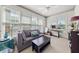 Cozy Living Room with large window, comfortable sofa, and workspace at 1376 Parkview Ne Ln, Atlanta, GA 30324
